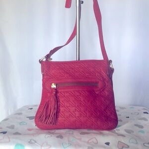 Red genuine leather quilted design crossbody w/ adjustable strap. Gold hardware.